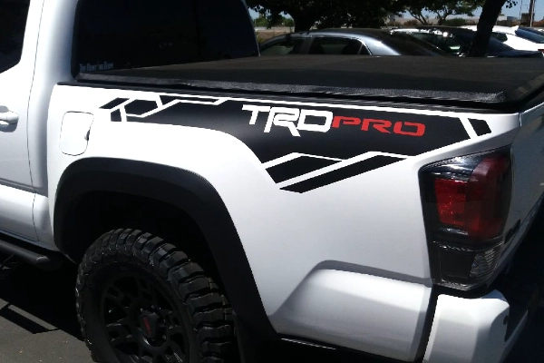 Toyota Tacoma TRD Pro custom vinyl decal on a white truck bedside