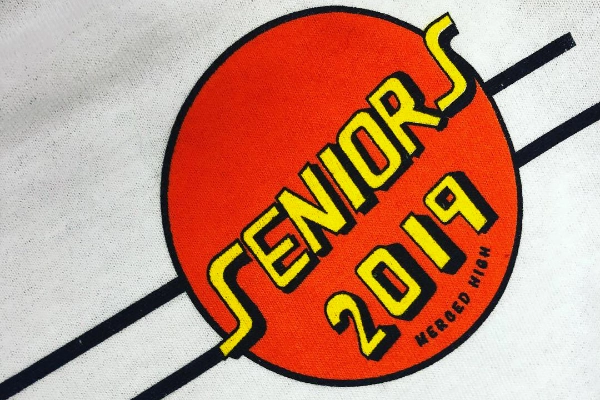 Close-up of Seniors 2019 Merced High screen print on a white tee